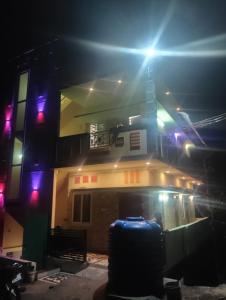 a building with a light on top of it at night at UP enterprices in Yercaud