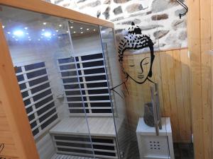 a shower stall with a painting of a woman at Le Barriol in Saint-Julien-Chapteuil +42 photos
