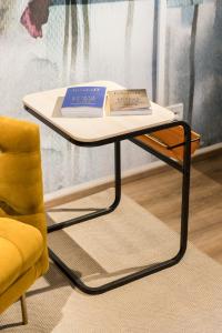 a table with two books on top of it at CHICLIVING Appartements in St. Wolfgang