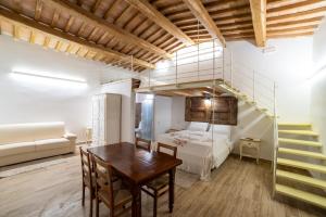 a living room with a loft bed and a table at Agriturismo Mamma Maria in Montefiascone +41 photos