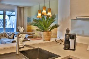 a kitchen with a coffee machine on a counter at Zuri Suite in Rittersdorf