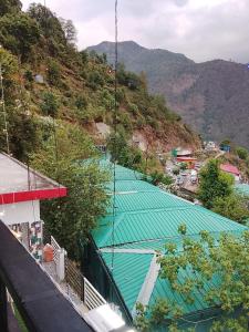 an overhead view of two tennis courts on a mountain at Dev Giri Guest House in Phata