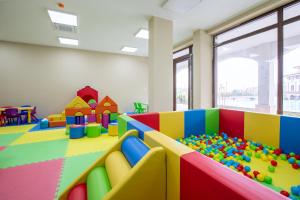 a childrens room with a play area with toys at SoleMare Luxury 2 Bedroom Apartment in Aheloy