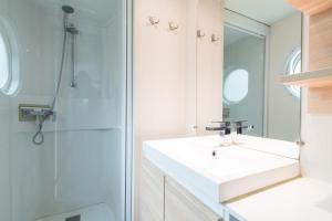 a bathroom with a sink and a shower at Camping Het Veen in Brecht