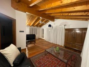 a living room with a couch and a table at Casa Elisabeth in Sarnico