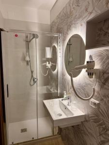 a bathroom with a shower and a sink at MiraMare Residence Cefalú in Cefalù +57 photos