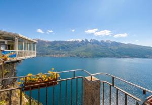 a view of a lake with mountains in the background at Appartamenti Fossato in Tremosine Sul Garda