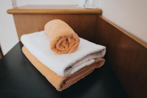 a pile of towels sitting on top of a table at Penzion U Libuše Luleč in Lultsch