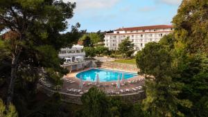 an aerial view of a hotel with a swimming pool at Canvas by Mitsis Alexander the Great in Kriopigi