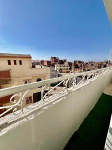 a balcony with a view of a city at Center Apartment in Aswan
