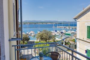 a balcony with a view of a marina at City center studio apartment in Malinska