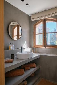 a bathroom with a sink and a mirror at Bastide Saint-Honorat in Grasse +28 photos