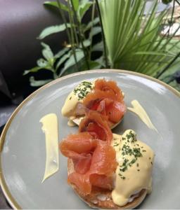 a plate of food with tomatoes and cheese on it at Stattons Boutique Hotel & Restaurant in Portsmouth