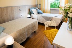 a small room with two beds and a couch at Hotel La Fonte in Osimo +66 photos