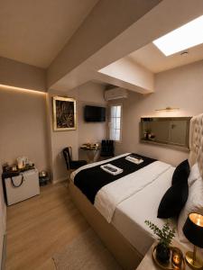 a bedroom with a large bed and a couch at Luka Suit Hotel in Istanbul