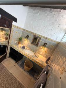 a bathroom with a sink and a counter top at Casa Portillo in Puerto Vallarta