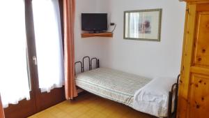 Posteľ alebo postele v izbe v ubytovaní Hotel Piccolo Mondo