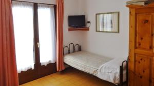 Posteľ alebo postele v izbe v ubytovaní Hotel Piccolo Mondo