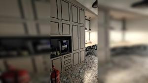 two pictures of a room with a wall with a fire extinguisher at Hotel O Green Home Hotel in Sepang +27 photos