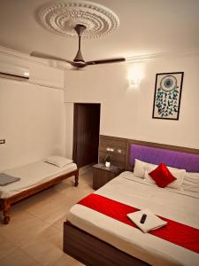 a bedroom with two beds and a ceiling at Dreamy serenity beach side in Pondicherry