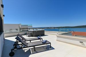 a view of a balcony with a barber shop at Villa Oasis in Trogir