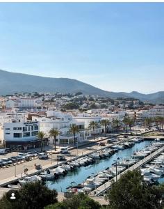 a marina with parked cars and a bunch of boats at Camino de Santiago Can Pau Costa Brava in Llança