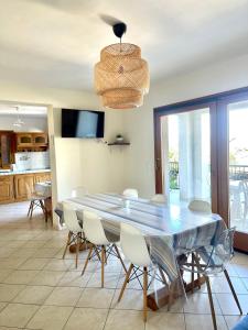 a dining room with a table and chairs at Apartment Blue Bay in Malinska