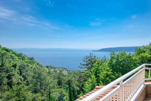 a balcony with a view of the water at Villa Pia by Briskva in Brseč
