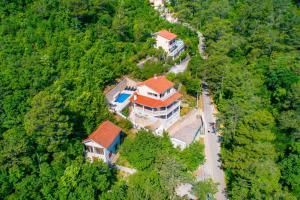 an aerial view of a large house in the forest at Villa Pia by Briskva in Brseč