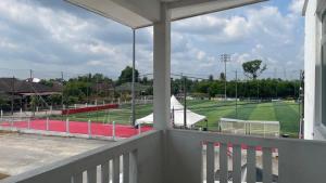 a view of a baseball field from a balcony at Hotel O HNR INN in Kuala Terengganu