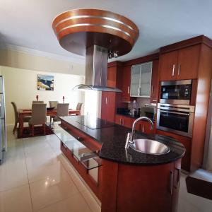 a kitchen with a sink and a counter top at Spacious 4BR Home Pool Balconies Krantzkloof in Kloof