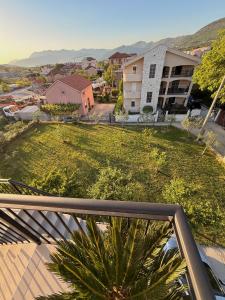 a view of a yard from the balcony of a apartment at AZA holiday in Kotor