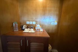 a kitchen with a wooden counter top with a tea kettle at Hi Blue Bali Melasti Dive Resort in Karangasem +60 photos