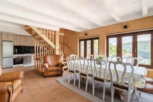 a dining room with a table and chairs at Casa Pinhão De Sousa in Vieira do Minho