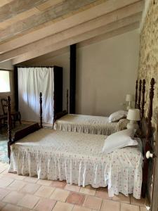 a bedroom with two beds in a room at Can Peñes in Port d'Andratx