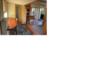 a view of a living room and a kitchen at Tensings Bungalow in Vitte