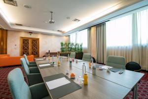 a conference room with a long table and chairs at Etrusco Arezzo Hotel - Sure Hotel Collection by Best Western in Arezzo