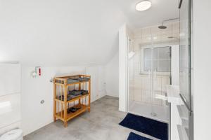 a bathroom with a shower and a toilet at Süße kleine Wohnung in Eggstedt +29 photos
