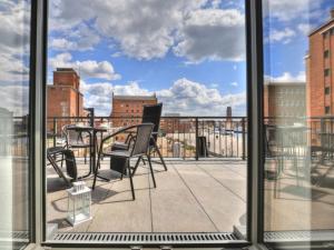 a view of a balcony with a table and chairs at Ohlerich Speicher App_ 02 in Wismar