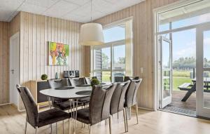 a dining room with a table and chairs at Awesome Home In Haderslev With Sauna in Haderslev