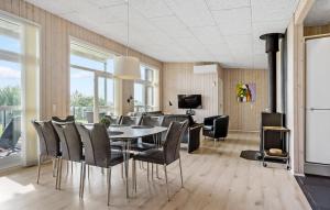 a dining room with a table and chairs at Awesome Home In Haderslev With Sauna in Haderslev