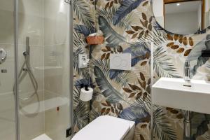a bathroom with a shower and a toilet and a sink at Hotel Pace in Brenzone sul Garda +138 photos