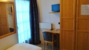 Postel nebo postele na pokoji v ubytování Hotel Giardino