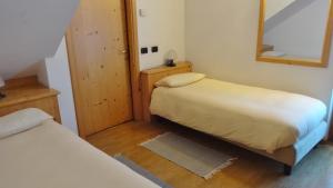 Postel nebo postele na pokoji v ubytování Hotel Giardino