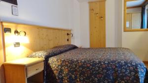 Postel nebo postele na pokoji v ubytování Hotel Giardino