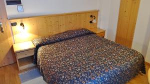Postel nebo postele na pokoji v ubytování Hotel Giardino