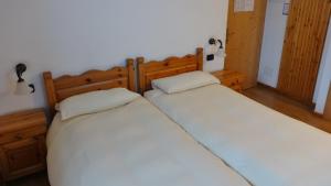 Postel nebo postele na pokoji v ubytování Hotel Giardino