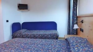 Postel nebo postele na pokoji v ubytování Hotel Giardino