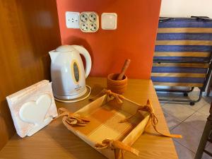 a wooden table with a model of a boat on it at Soft Horizon Apartment in Loutraki