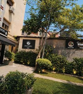a building with signs on the side of it at Moon e Sky in Tirana